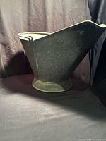 Right side profile of galvanized metal coal scuttle showing pour spout and pedestal base