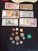 Full lot overview showing six banknotes and thirteen coins