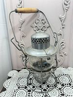 Full view of galvanized CPR railroad lantern with wood handle