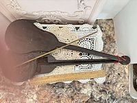 Full view of wooden beam scale beside ruler showing length