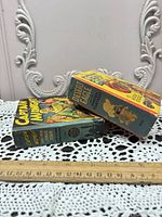 Side view of books displaying cover art and thickness