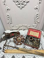 Overall lot showing block plane, valve wheel, hand rake, Craven A tin (open) with brass fittings