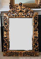 Front view of gilt wood mirror showing entire frame and glass