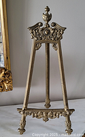 Full view of ornate brass easel stand