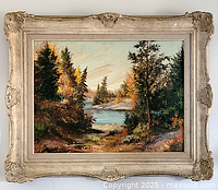 Frontal view of framed landscape painting