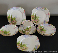 Full set laid out showing cup, saucer and plates