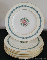 Stack of eight Wedgwood plates showing pattern and quantity