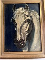 Front view of framed oil painting showing white horse portrait