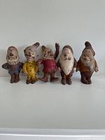 Front view of all five latex Walt Disney dwarf figurines