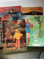 Five Barbie Talk magazines fanned out showing cover artwork