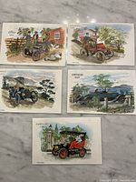 Fronts of five vintage car greeting cards laid out showing Ford 1896, Maxwell 1909, Buick 1904, Chrysler 1929, Cadillac 1903 illustrations