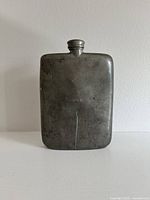 Front view showing overall form and surface scratch