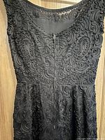 Upper bodice close-up showing corded soutache detail and neckline