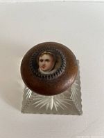 Top view showing cameo portrait on lid and square crystal base