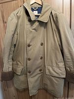 Front view of khaki Gap double-breasted car coat with corduroy cuffs