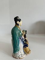 Left side view of the ceramic couple figurine