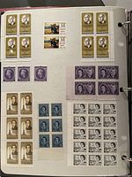 Album page with mint blocks: 4-cent Queen Elizabeth II, 50-cent Voyageurs, 4-cent Queen Elizabeth purple, 5-cent Queen Elizabeth blocks and sheets