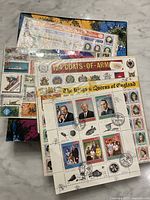 Group of loose full stamp sheets on top of album