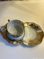 Cup seated on matching snack plate showing overall design