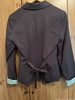 Back view of dark charcoal Mexx blazer with tie detail