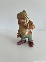 Front view of Bashful figurine showing facial features and color details