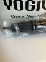 black plastic manual pump in plastic wrap