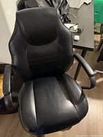 Front view of chair showing seat, backrest and armrests