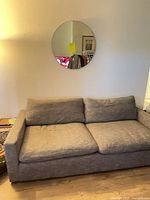Front view of gray woven fabric sofa with two seat and back cushions
