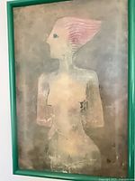 Full view of framed abstract nude painting with green frame