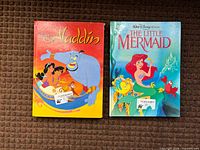 Front covers of both hardcover Disney books