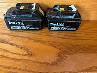 Front view showing Makita 18V 5.0Ah and 4.0Ah batteries