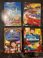 Group shot of four Disney DVD cases