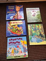 All five hardcover children’s books front covers visible