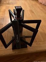 Full view of rotating frame tower showing multiple frames around central pedestal