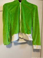 Front view of green zip-up hoodie showing hood, zipper, white cuffs and waistband