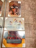 All three laminated Anne Geddes prints stacked vertically