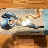 Retail box front showing BaBylissPRO MiraCurl Nano Titanium branding