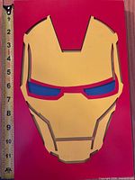 Front view showing Iron Man mask design and measuring tape indicating height