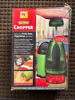 Front of sealed box listing product name and uses