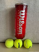 Canister front with three balls displayed