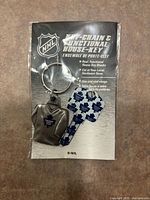 Front of sealed package showing keychain and key with Toronto Maple Leafs branding