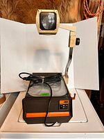 Full view of 3M overhead projector with arm extended and mirror head