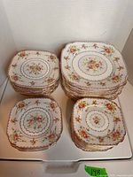 Stacks of Royal Albert Petit Point square plates, various sizes