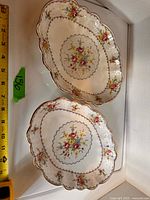 Both Royal Albert oval platters top view with measuring tape for scale