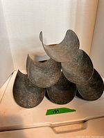 Front view of galvanized tin pyramid wine rack with six curved holders