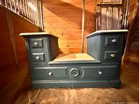 Front view showing entire chiffonier base, pedestals, marble tops, central recessed area, lower drawer