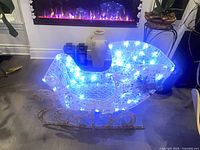 Sleigh illuminated with blue LEDs