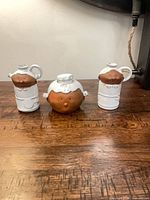 front view of three ceramic character pieces