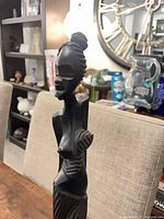 Close-up of first wooden sculpture torso and head