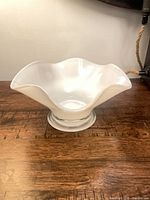 Overall view of Orrefors Cantarel opalescent glass bowl on wood surface